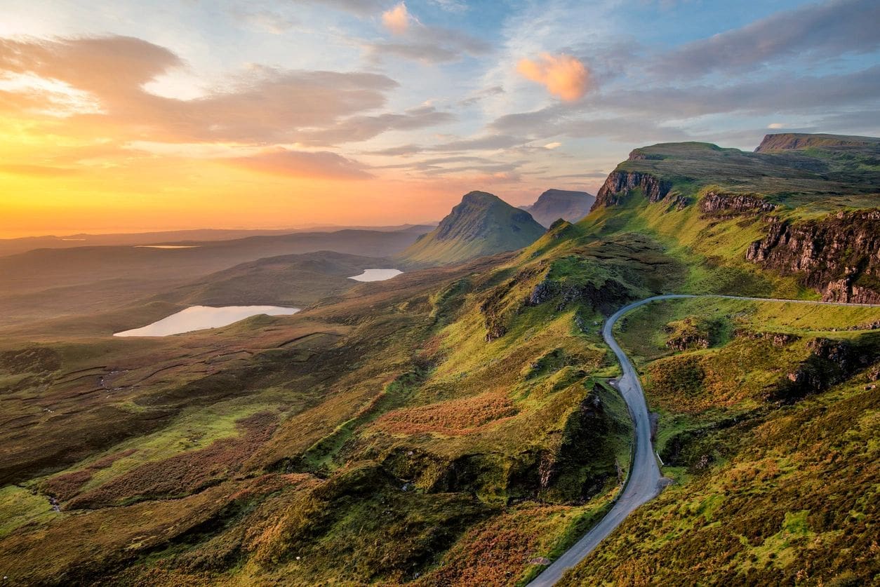 A road going down the side of a mountain.